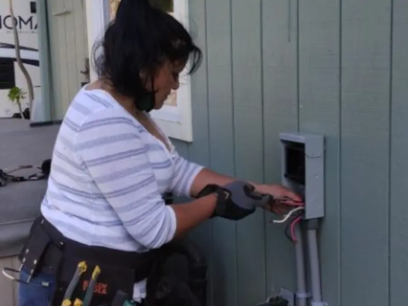Licensed electrician wiring an exterior subpanel in Biscayne Park