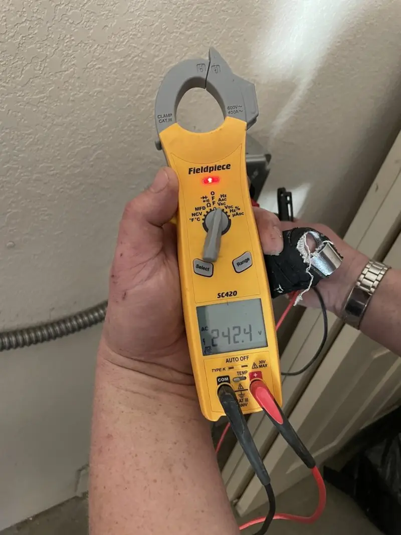 Voltage testing with clamp meter during Electrical Installation Services in Biscayne Park